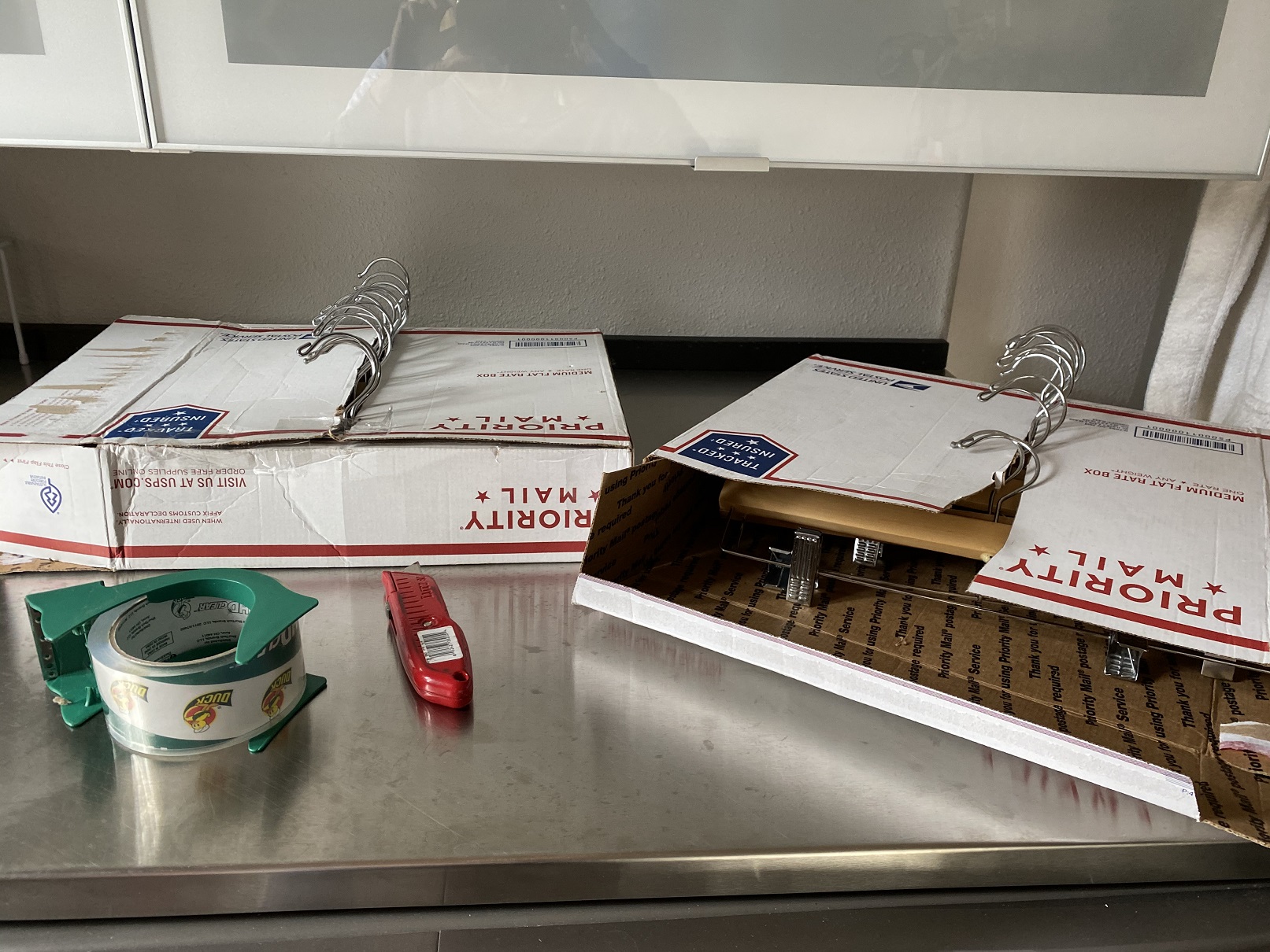 Store hangers in boxes to maximize hanging space 