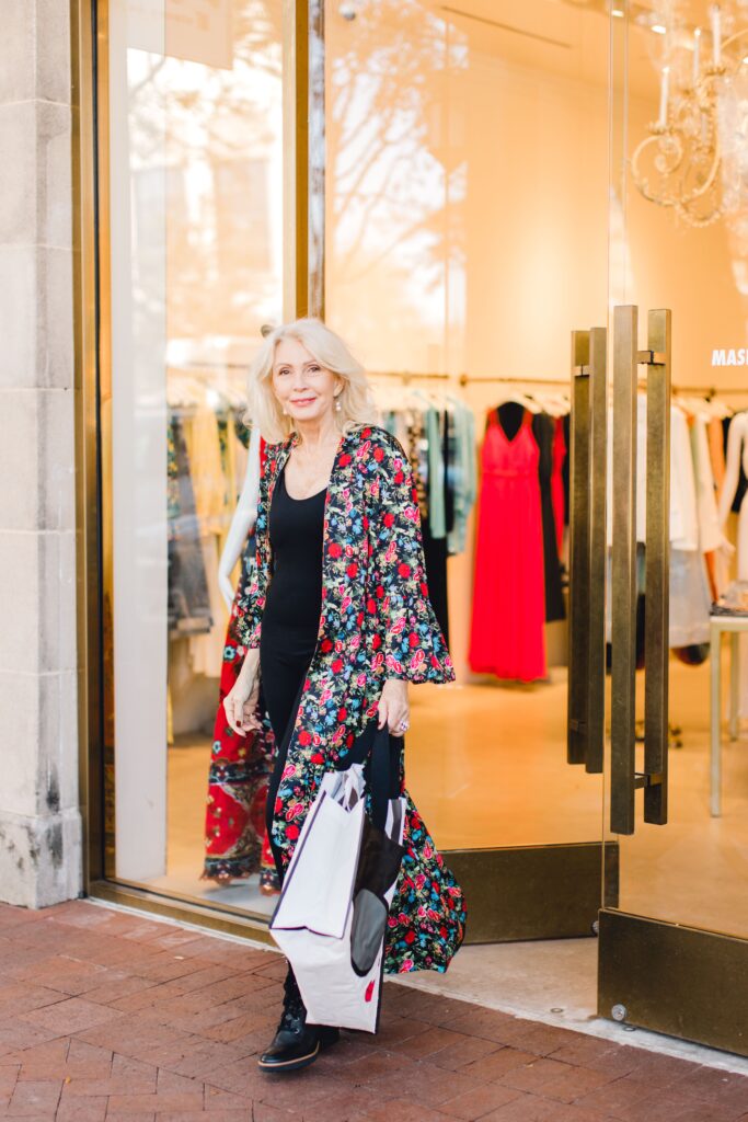 Women wearing a reversible kimono with black leggings, cami and combat style boots for the spring travel capsule wardrobe edit