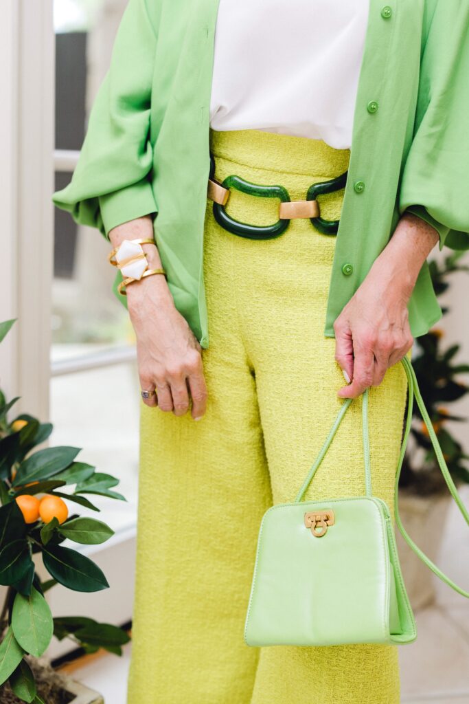 close up of green bag and green art deco belt