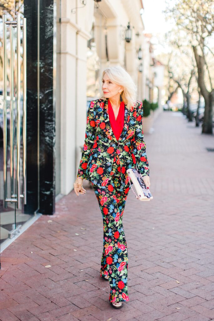 Sonia with red top and all floral pant suit.