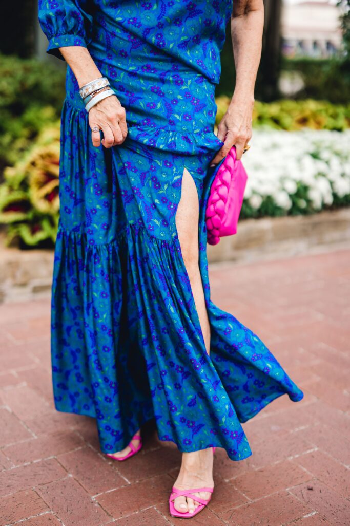 Blogger wearing Veronica Beard skirt and pink accessories