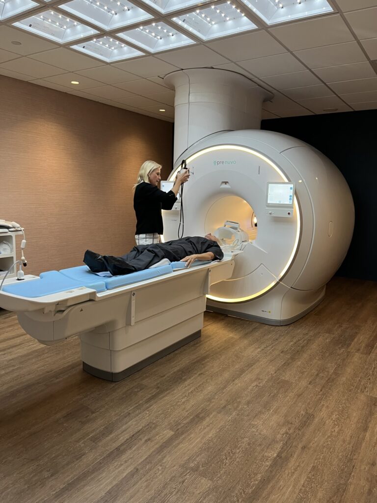 Woman lying in Prenuvo body scan MRI machine