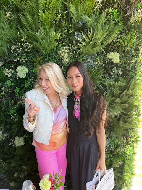 Style beyond age and a friend posing in front of a wall of greenery